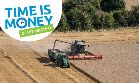 Combine harvester in a field